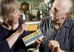 Father and daughter discussing medication